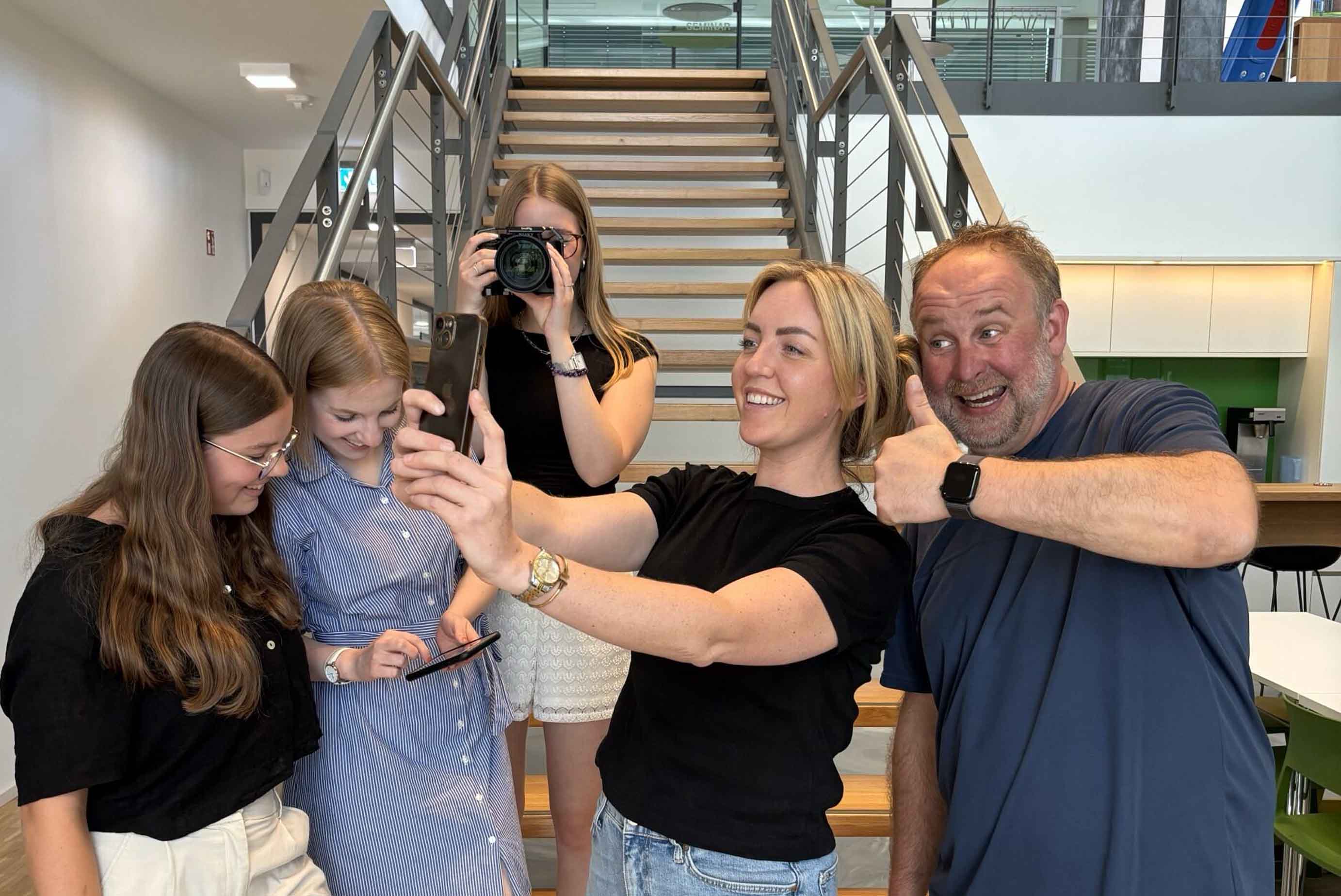 group photo, people, selfie, casual clothing, indoor staircase
